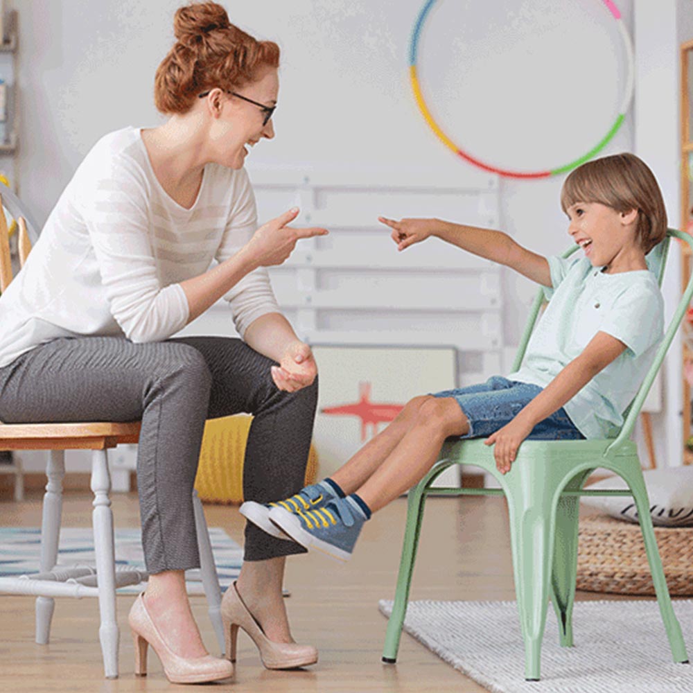 a therapist talking to a young boy